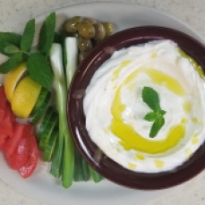 Labne. Also known as Kefir Cheese. served with olives, and a variety of vegetables $8.00